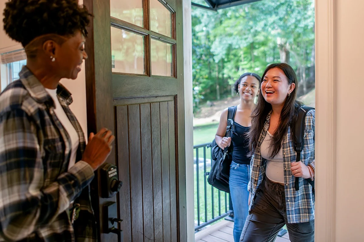 A group of students meet when moving in to new student housing