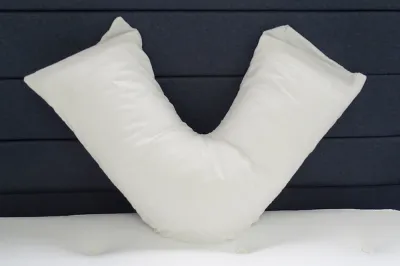 norfolk-v-shape-pillow-on-white.webp